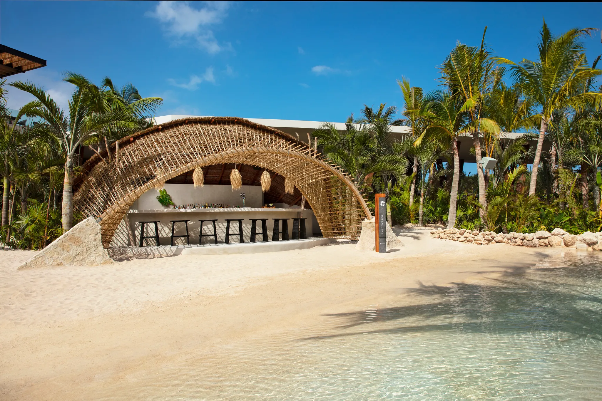 The Cove Bar beach and pool bar at Secrets Moxché Playa del Carmen for oceanfront drinks and relaxation