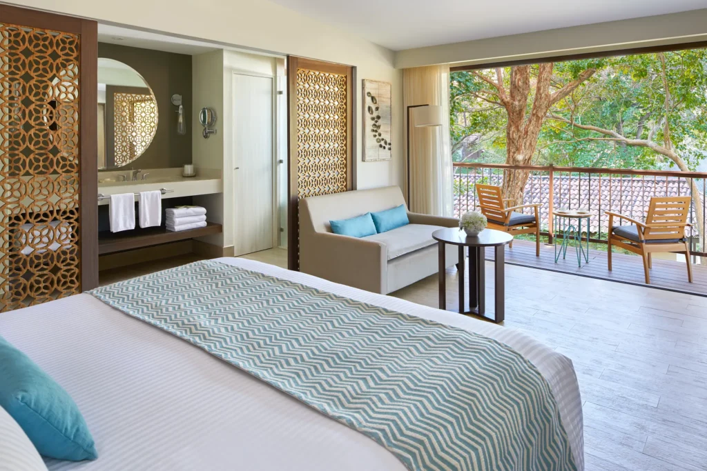 Bungalow Suite Tropical View with king-size bed at Secrets Papagayo Costa Rica.