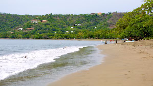 Coco Beach near Secrets Papagayo Costa Rica with lively beachfront, dark sand, and Pacific Ocean views