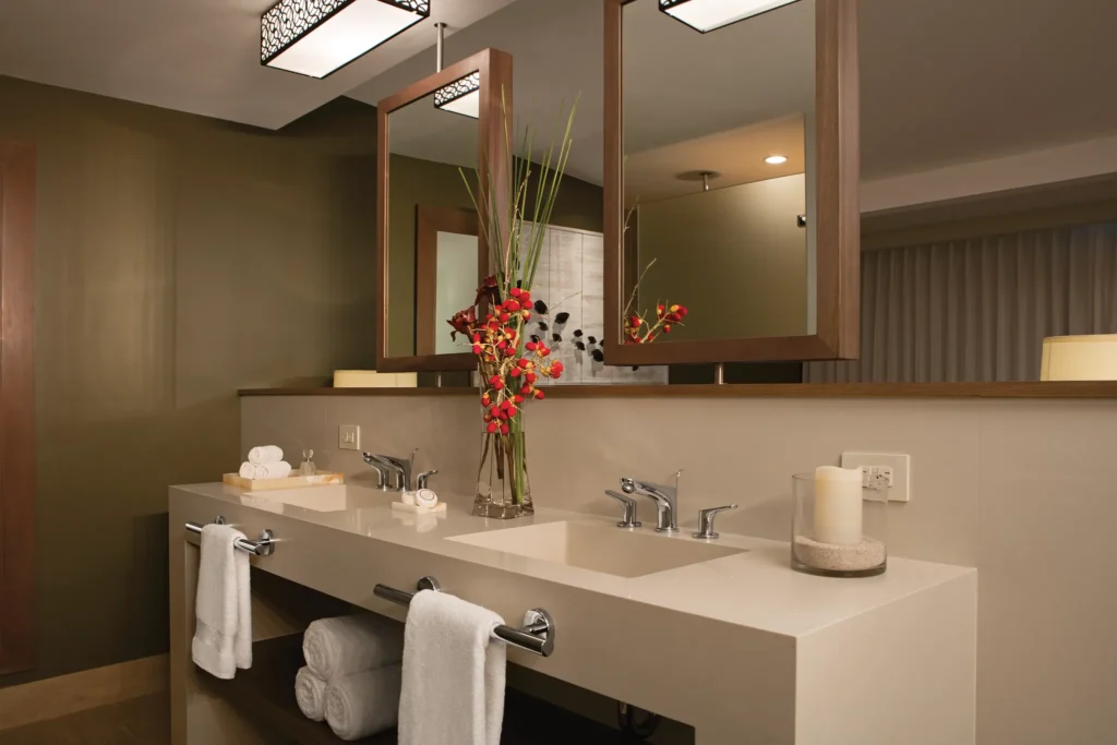 Deluxe Ocean View King bathroom with double sinks and modern décor at Secrets Papagayo Costa Rica.