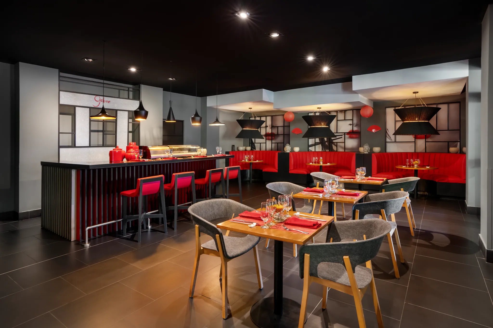 Himitsu Pan-Asian Restaurant at Secrets Papagayo Costa Rica featuring a modern dining room with red accents, sushi bar seating, and contemporary Asian-inspired décor.