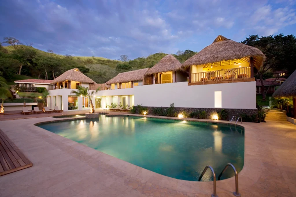 Outdoor spa relaxation area with massage beds overlooking the ocean at Secrets Papagayo Costa Rica.