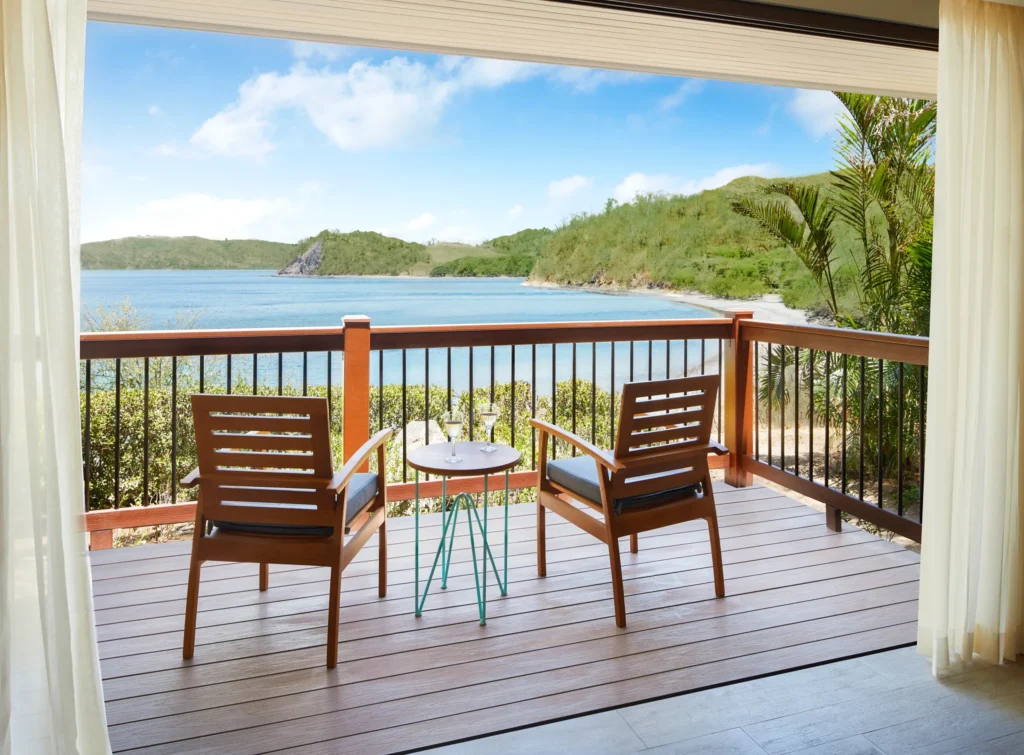 Private furnished balcony with direct oceanfront views at the Preferred Club Bungalow Suite in Secrets Papagayo Costa Rica.