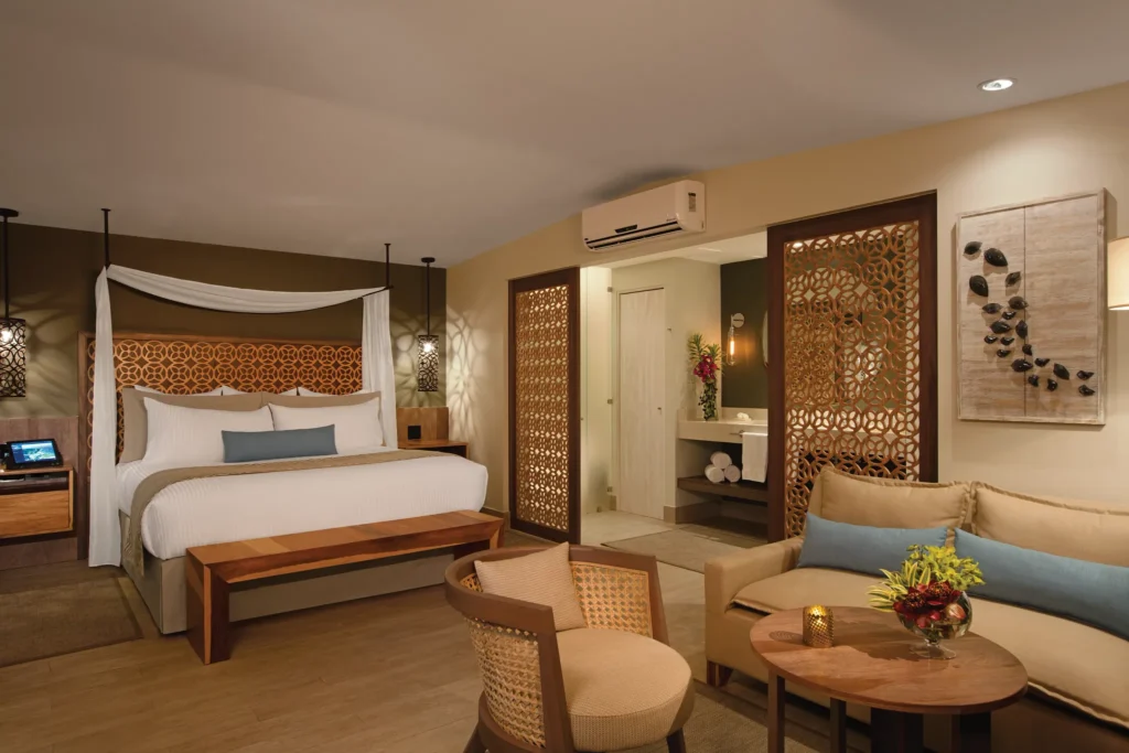 Preferred Club Bungalow Suite Ocean Front with king bed and seating area at Secrets Papagayo Costa Rica.