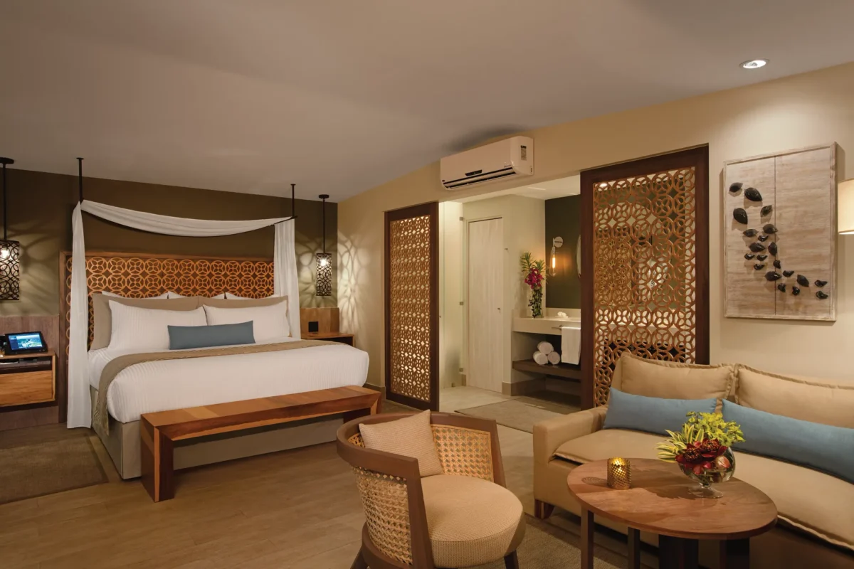 Preferred Club Bungalow Suite Ocean Front with king bed and seating area at Secrets Papagayo Costa Rica.