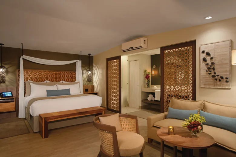 Preferred Club Bungalow Suite Ocean Front with king bed and seating area at Secrets Papagayo Costa Rica.