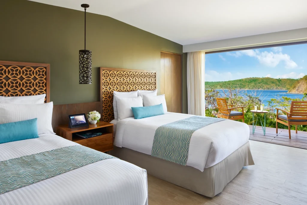 Preferred Club Bungalow Suite Ocean View with two double beds at Secrets Papagayo Costa Rica.
