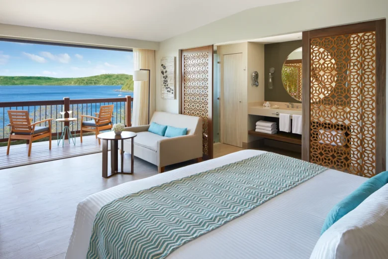 Preferred Club Bungalow Suite Ocean View interior with seating area and balcony access at Secrets Papagayo Costa Rica.