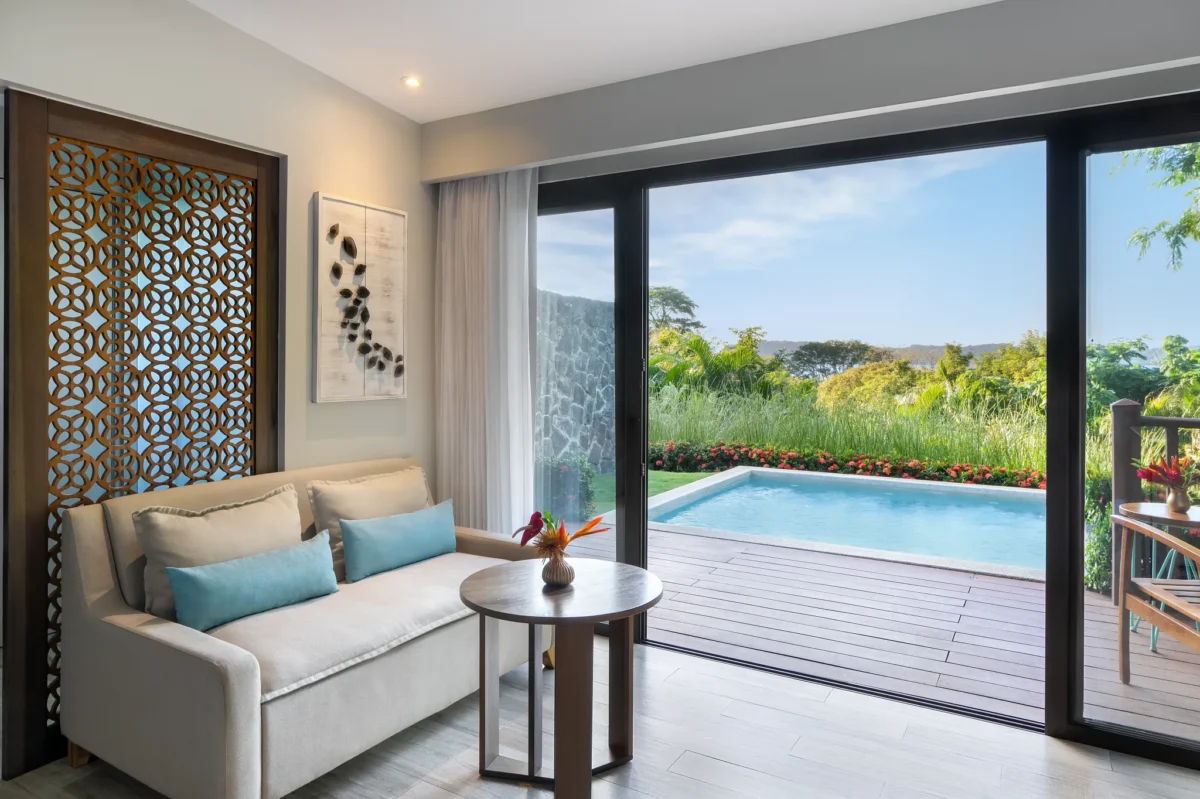 Preferred Club Junior Suite living area with sliding doors opening to a private plunge pool at Secrets Papagayo Costa Rica.