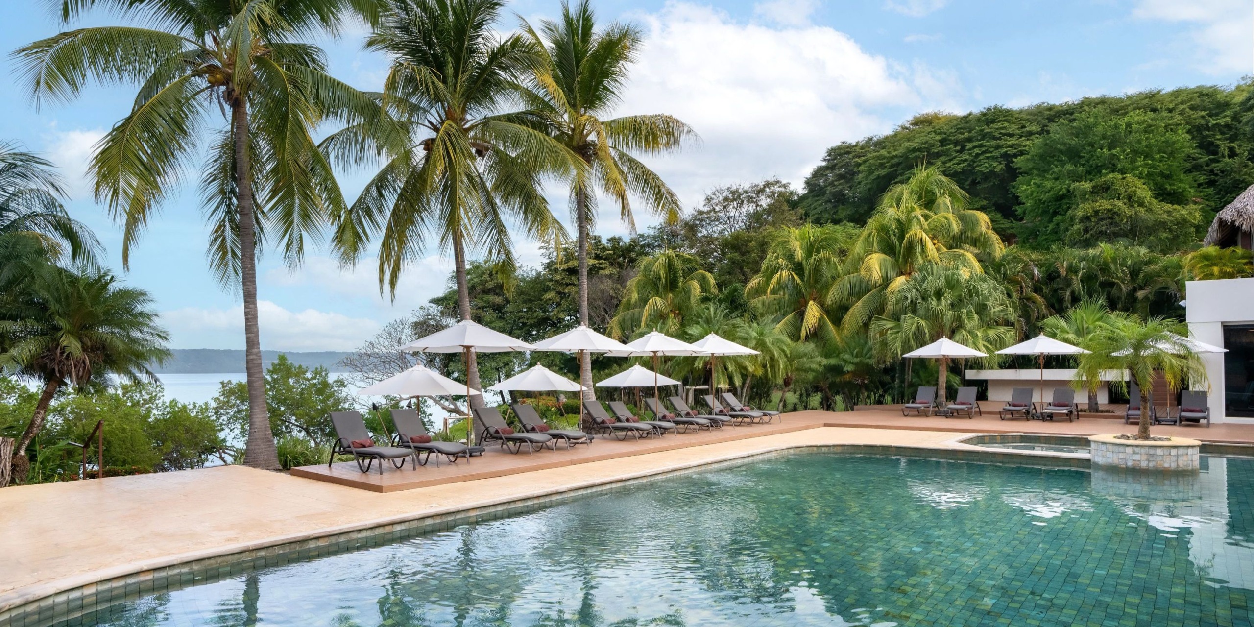 Spa Pool Deck wedding venue at Secrets Papagayo Costa Rica with tropical poolside ceremony setup