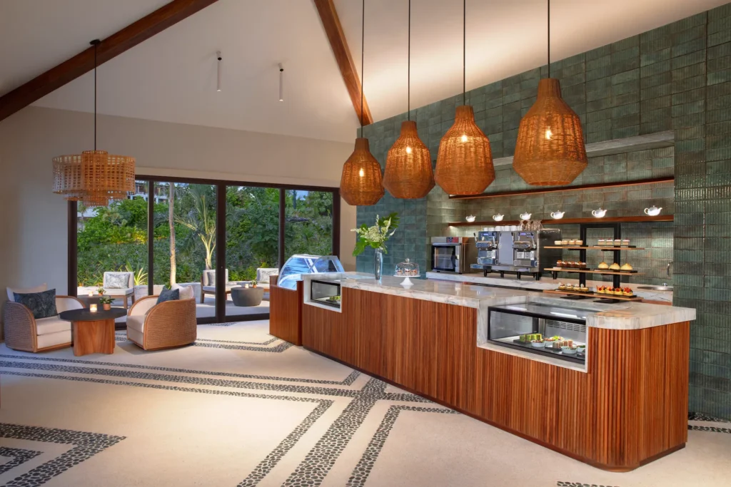 Coco Café at Secrets Playa Blanca Costa Mujeres featuring a bright indoor-outdoor coffee bar with pastries, light snacks, and specialty coffee drinks.