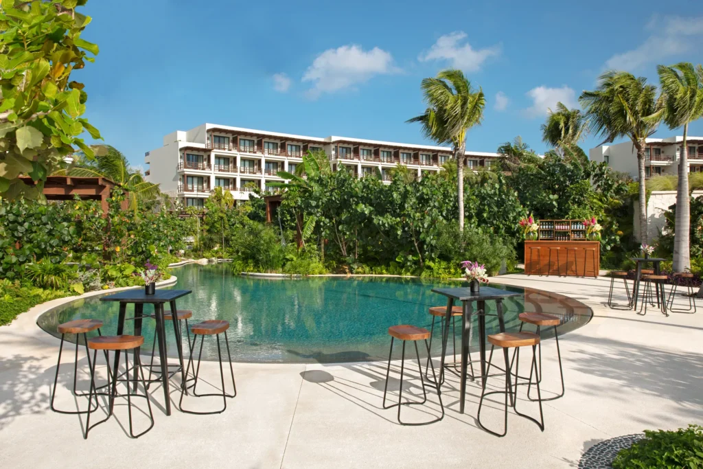Jungle Pool Terrace cocktail setup with lagoon-style pool at Secrets Playa Blanca Costa Mujeres