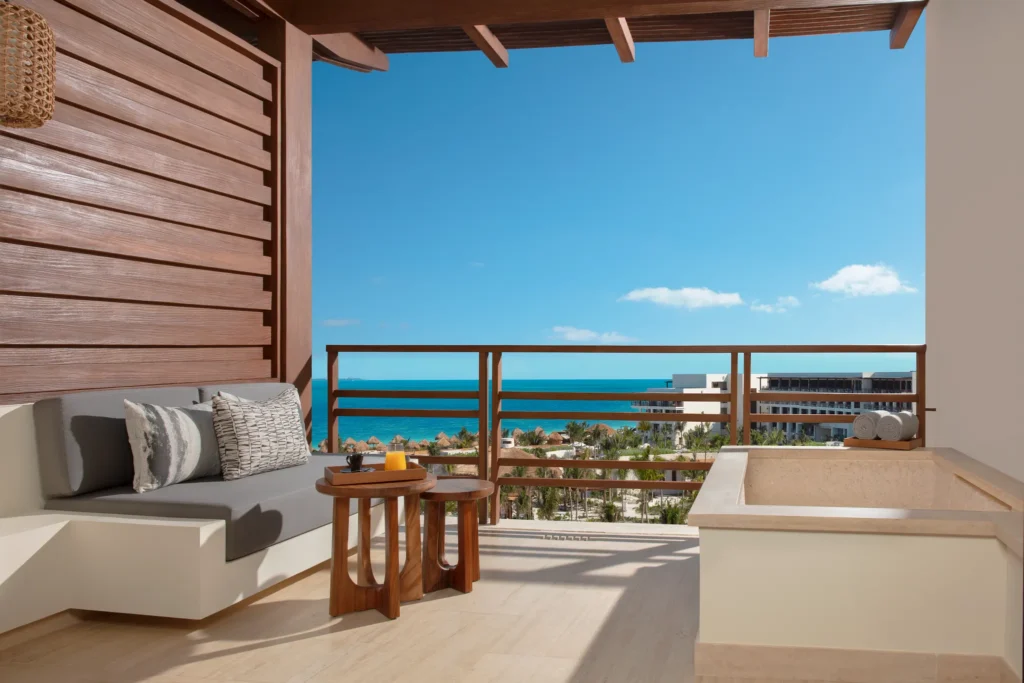 Preferred Club Junior Suite Ocean View terrace with outdoor soaking tub and ocean views at Secrets Playa Blanca Costa Mujeres.