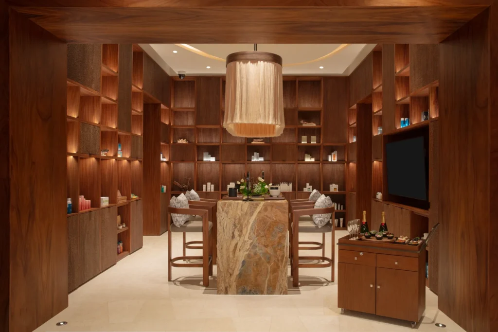 Luxury spa skin bar with skincare displays and seating area at Secrets Playa Blanca Costa Mujeres, perfect for personalized beauty treatments.