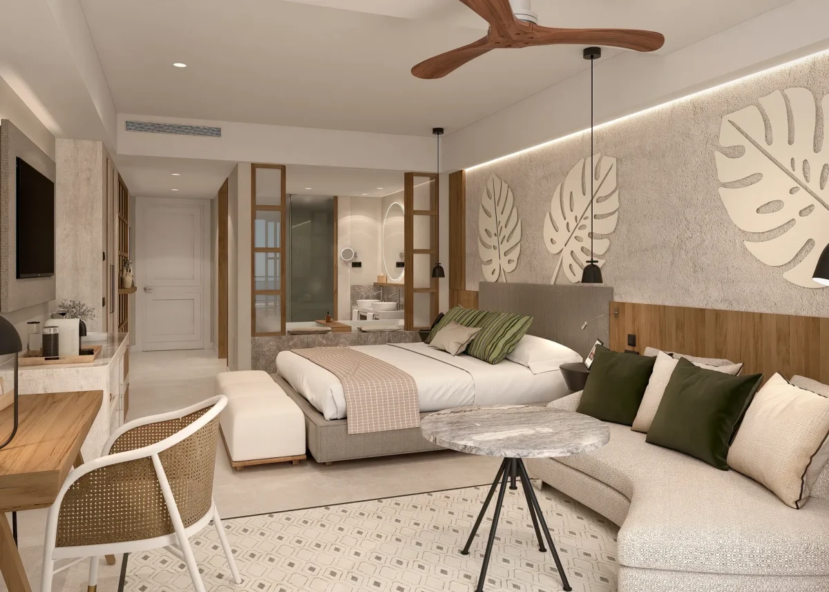 Preferred Club Junior Suite Partial Ocean View with king bed and modern seating area at Secrets Playa Esmeralda Resort & Spa.