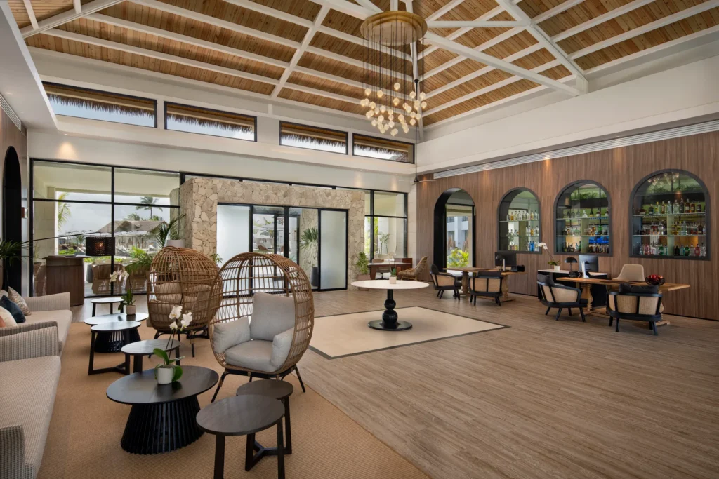 Upscale Preferred Club lobby with seating and decor at Secrets Playa Esmeralda Resort & Spa.