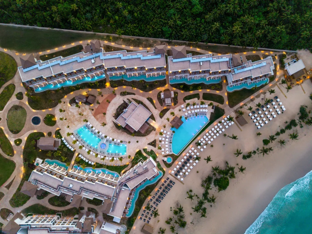 Top-down aerial view of resort pools and beachfront layout at Secrets Playa Esmeralda Resort & Spa.