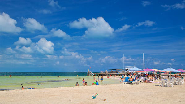 Langosta Beach near Secrets Playa Mujeres Golf & Spa Resort with calm Caribbean waters and sandy shoreline in Cancun