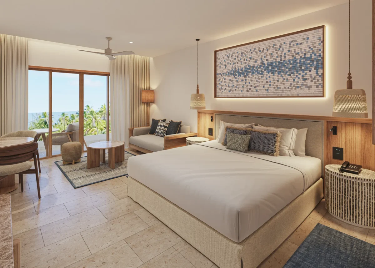 Preferred Club Junior Suite Ocean View Swim Out king bedroom with balcony access at Secrets Playa Mujeres Golf & Spa Resort.