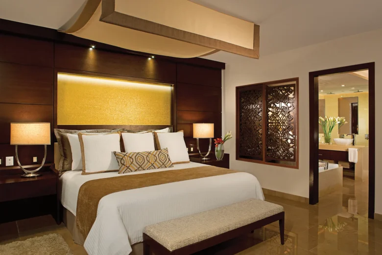 Preferred Club Master Suite Ocean Front Private Pool king bedroom at Secrets Playa Mujeres Golf & Spa Resort.