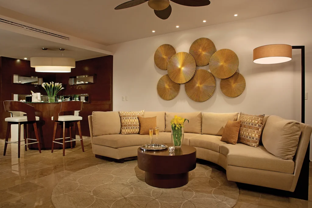 Preferred Club Master Suite Ocean Front Private Pool living room with sectional sofa at Secrets Playa Mujeres Golf & Spa Resort.