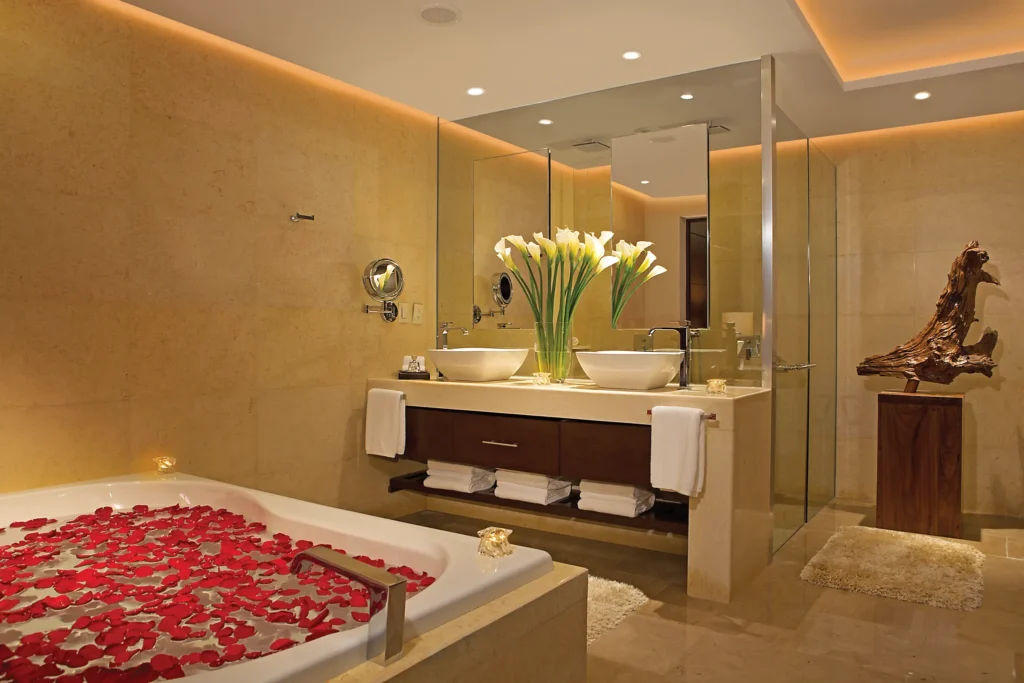 Preferred Club Master Suite Ocean View bathroom with soaking tub, double vanity, and glass rain shower at Secrets Playa Mujeres Golf & Spa Resort.
