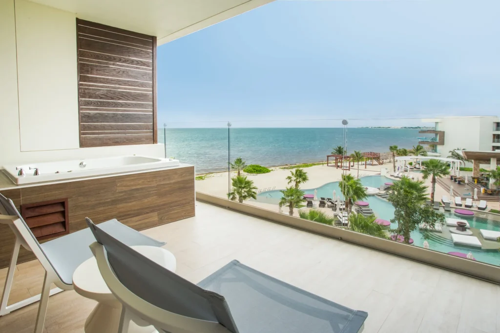 Preferred Club Junior Suite Ocean View terrace with hot tub and Caribbean Sea views at Secrets Riviera Cancun.