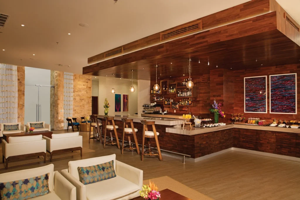 Preferred Club Lounge bar at Secrets Riviera Cancun featuring elegant seating, premium liquor selection, and exclusive members-only atmosphere.