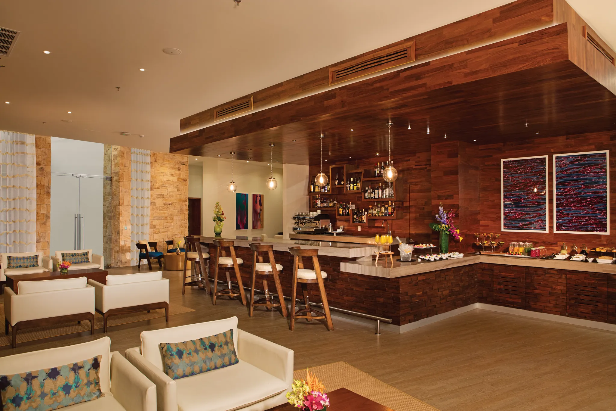 Preferred Club Lounge bar at Secrets Riviera Cancun featuring elegant seating, premium liquor selection, and exclusive members-only atmosphere.