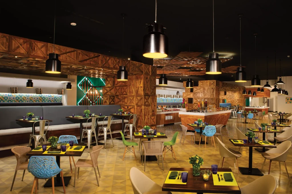 Spoon buffet restaurant at Secrets Riviera Cancun featuring modern dining space, international cuisine stations, and stylish seating.