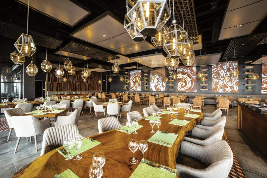 El Patio Mexican Restaurant at Secrets Royal Beach Punta Cana featuring elegant dining tables, warm lighting, and contemporary Mexican décor.