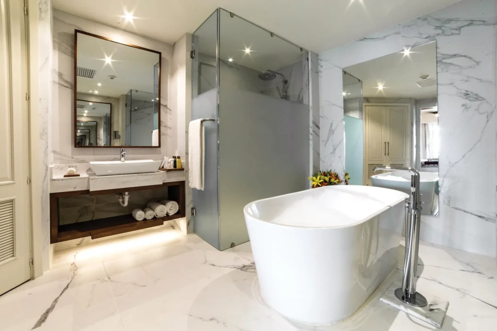Preferred Club Master Suite Ocean Front bathroom with freestanding tub and vanity at Secrets Royal Beach Punta Cana.