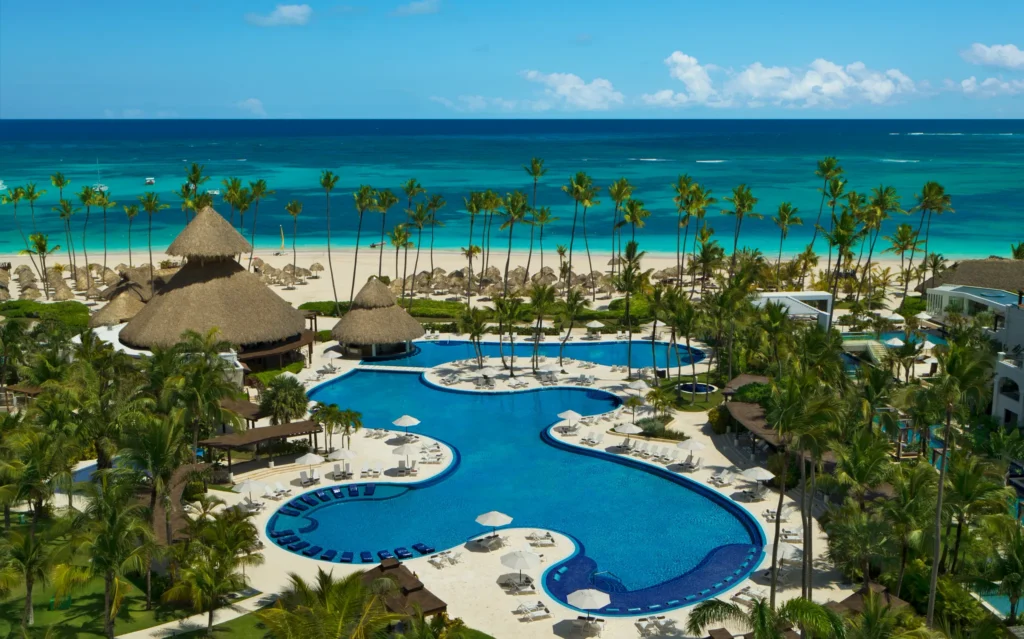 Aerial view of the expansive lagoon-style main pool at Secrets Royal Beach Punta Cana overlooking Bavaro Beach.