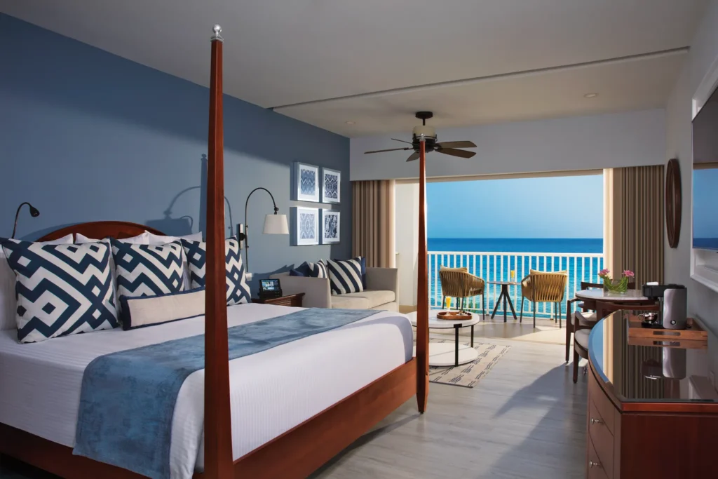 Junior Suite Ocean Front with king bed and private balcony overlooking the Caribbean Sea at Secrets St. James Montego Bay.
