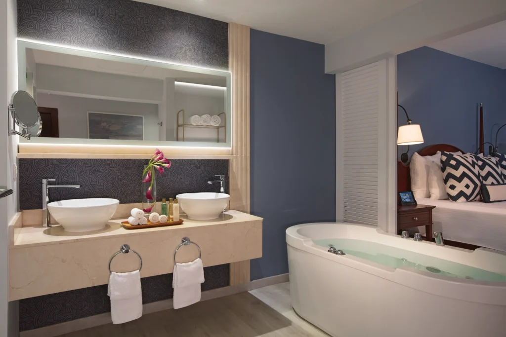 Junior Suite Ocean View bathroom with double sinks and soaking tub at Secrets St. James Montego Bay.