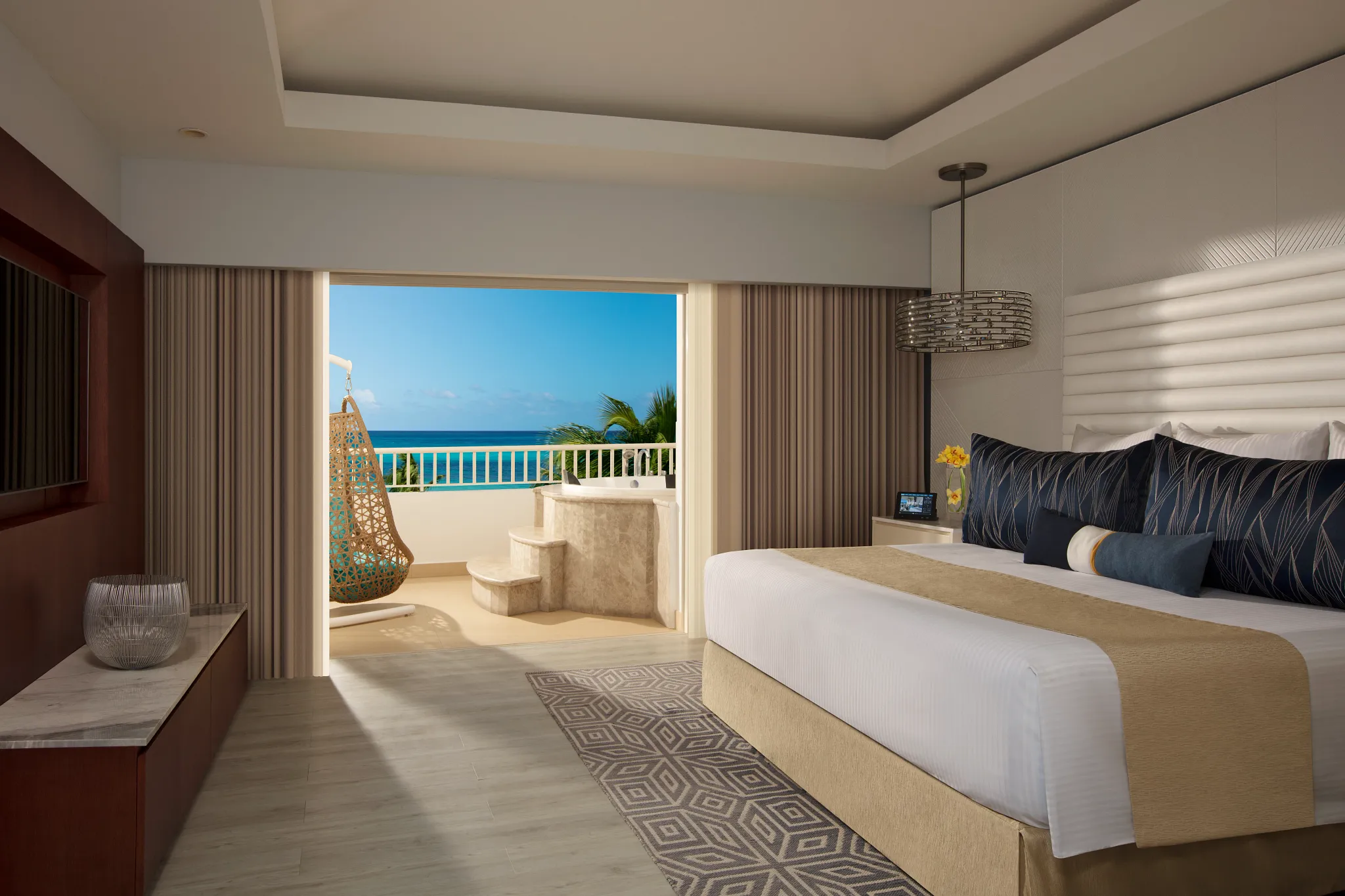 Preferred Club Presidential Suite Ocean Front bedroom with terrace and ocean view at Secrets St. James Montego Bay.