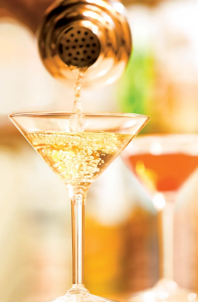 Rendezvous Lobby Bar at Secrets St. James Montego Bay featuring an elegant lounge with baby grand piano, stylish seating, and live evening music.