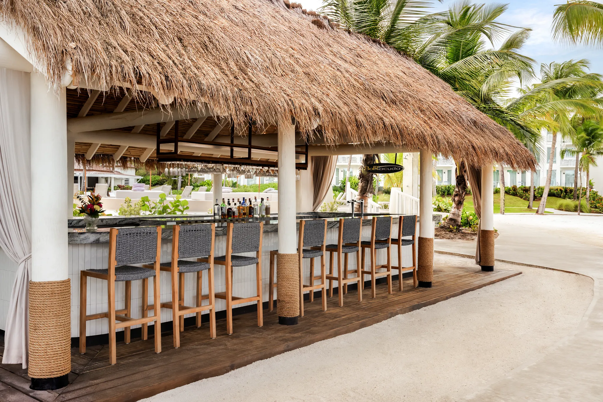 Barracuda Pool and Beach Bar at Secrets St. Lucia Resort & Spa featuring a relaxed beachfront setting with tropical cocktails and ocean views.