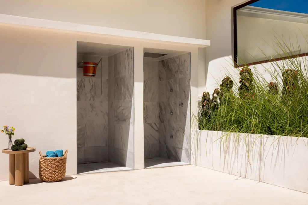 Outdoor spa bucket shower at Secrets St. Lucia Resort & Spa, designed for a refreshing hydrotherapy experience in a tropical setting.