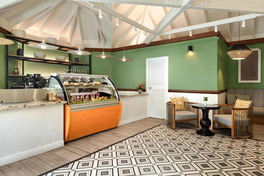 Coco Café at Secrets St. Lucia Resort & Spa featuring a cozy coffee bar serving premium espresso drinks and light snacks in a relaxed indoor setting.