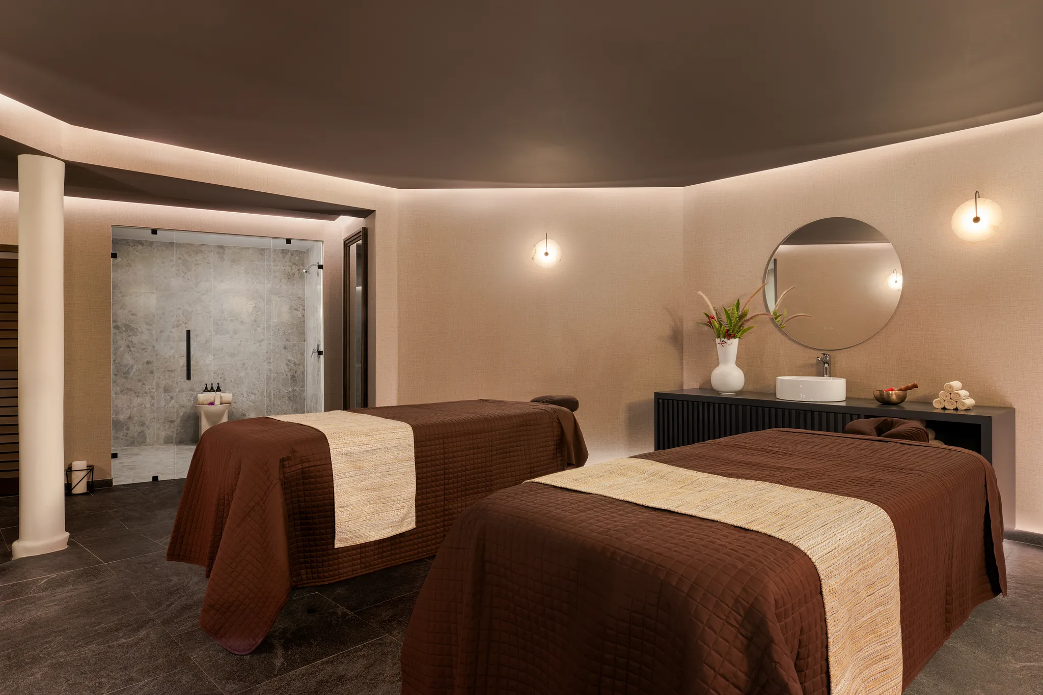 Couples massage suite at Secrets St. Lucia Resort & Spa with tranquil lighting and modern spa amenities.