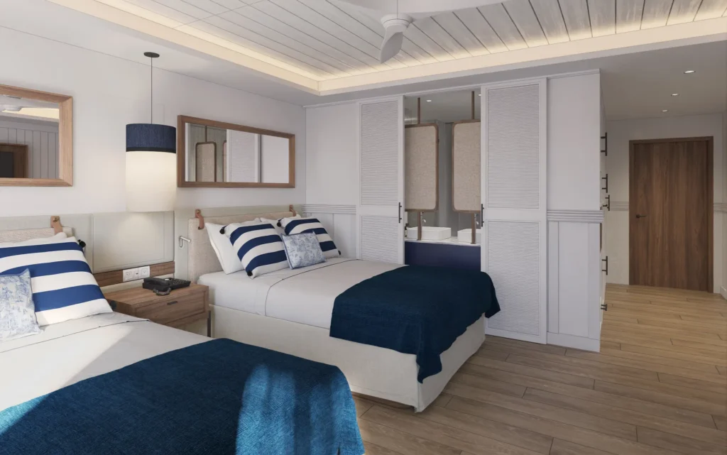 Deluxe Tropical View room with two double beds and modern coastal décor at Secrets St. Lucia Resort & Spa.
