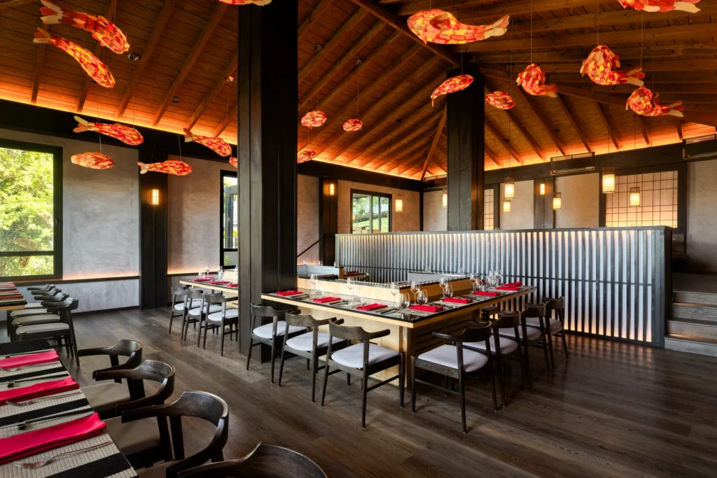 Himitsu restaurant at Secrets St. Lucia Resort & Spa featuring a stylish dining space with teppanyaki tables and Pan-Asian cuisine.