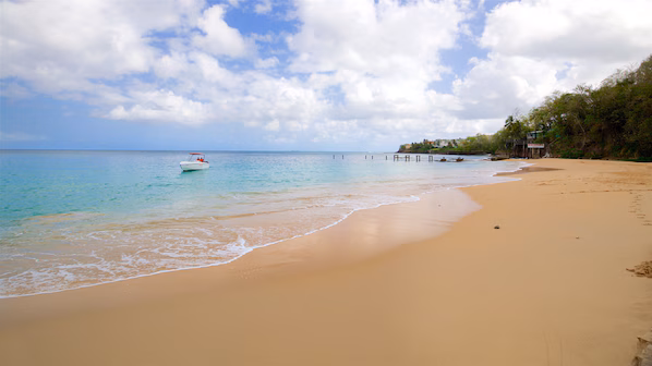 La Toc Beach near Secrets St. Lucia Resort & Spa with secluded golden sands and lush tropical surroundings