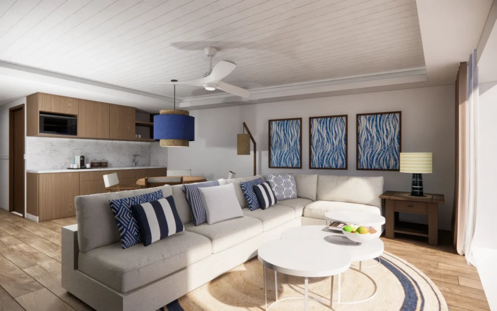 Preferred Club Bungalow Suite living room with sofa and kitchenette at Secrets St. Lucia Resort & Spa.