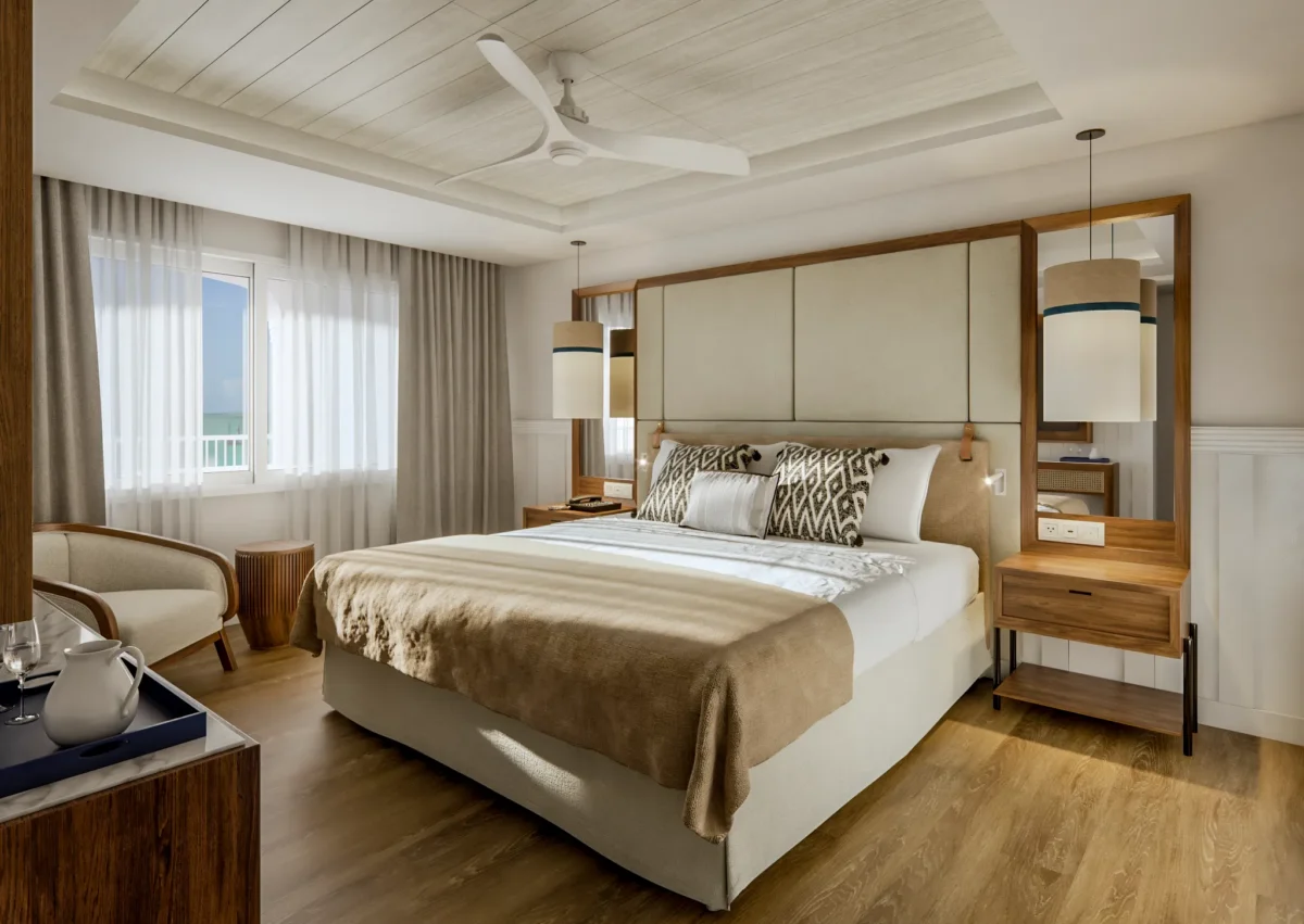 Preferred Club Presidential Suite bedroom with king bed and ocean view balcony access.