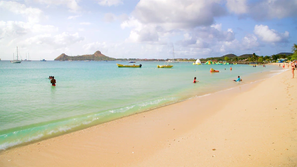 Reduit Beach near Secrets St. Lucia Resort & Spa with soft white sand and clear Caribbean waters