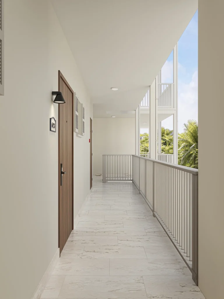 Bright open-air corridor with guest room entrances at Secrets St. Lucia Resort & Spa.