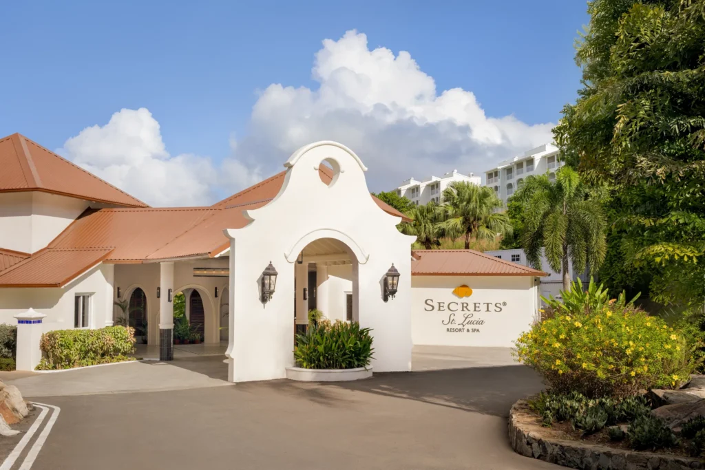 Entrance driveway and welcome arch at Secrets St. Lucia Resort & Spa.