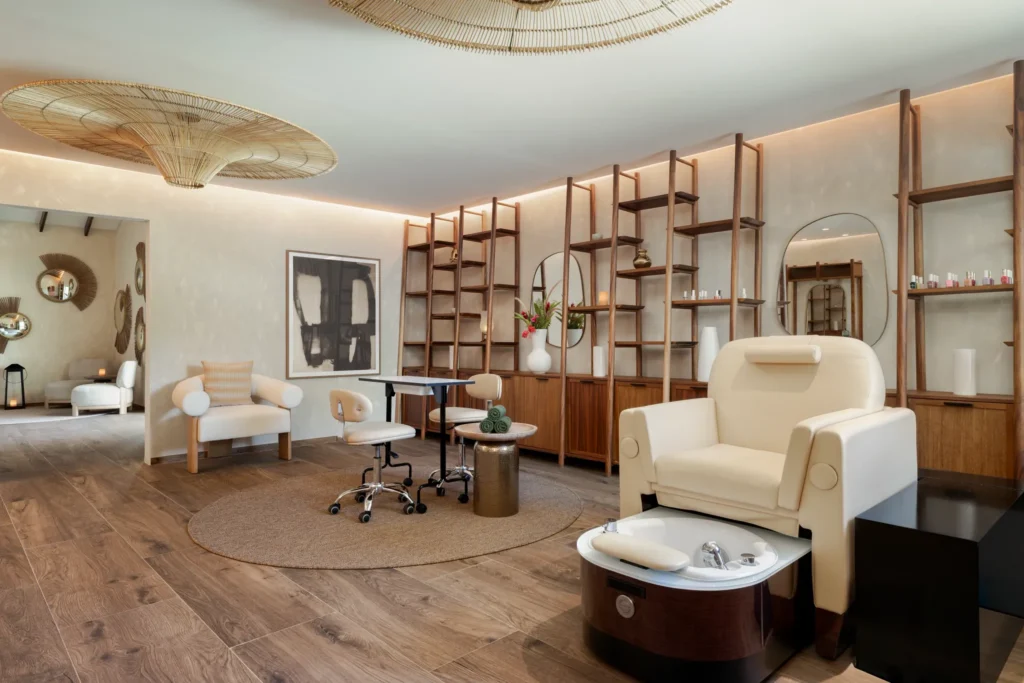 Full-service spa salon interior at Secrets St. Lucia Resort & Spa with manicure and pedicure stations in a modern setting.
